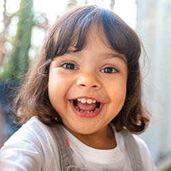 young girl smiling at daycare