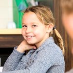 school age girl smiling