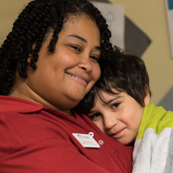 Teacher and child hugging