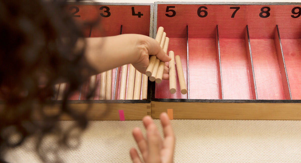 girl doing Montessori sorting activity