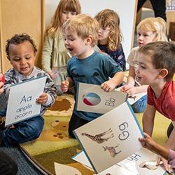 Children learning during carpet time with flashcards